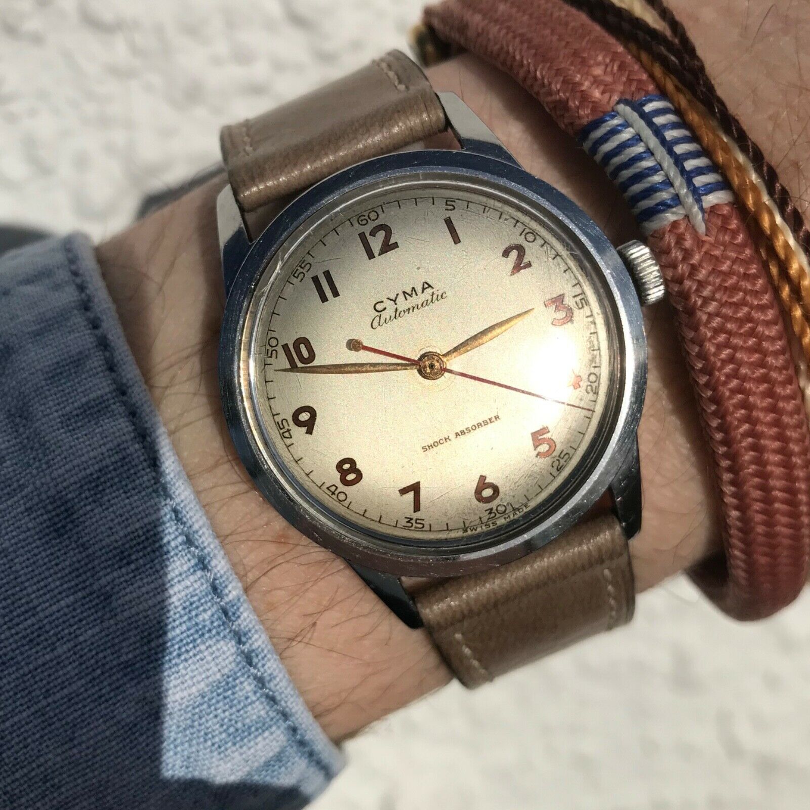 Stunning vintage 1940's Cyma automatic shock absorber gilt dial