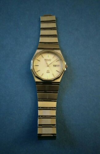 seiko quartz sq 100 gold watch