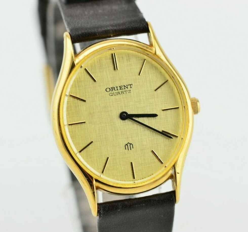 orient quartz watch gold