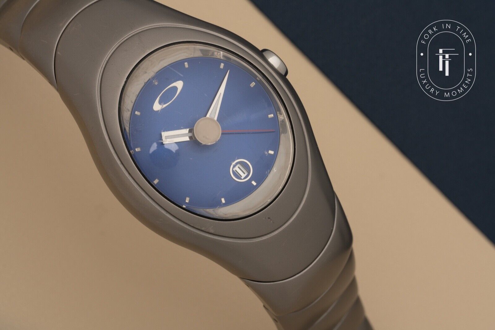 Oakley Icon Blue Sunburst Dial Titanium Watch Auto-Quartz Movement 