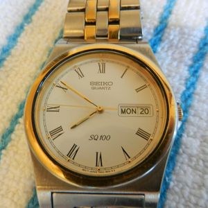 SEIKO QUARTZ SQ100 MENS WATCH DAY DATE STAINLESS AND GOLD. | WatchCharts