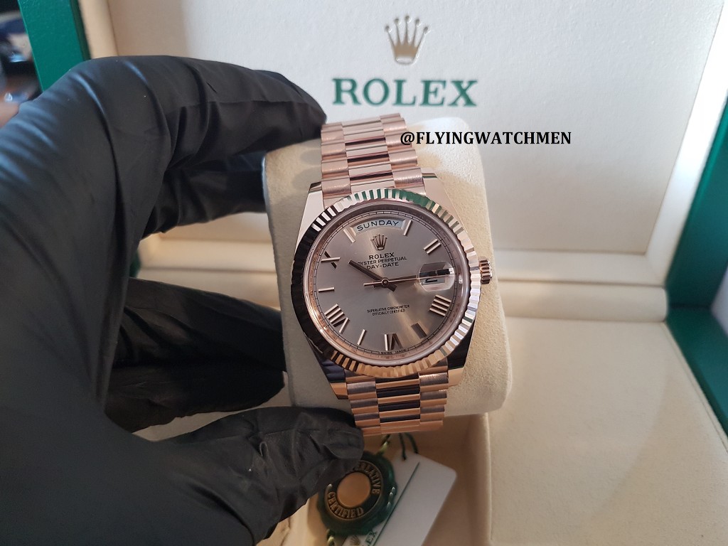 Rolex day date 40 outlet rose gold sundust dial