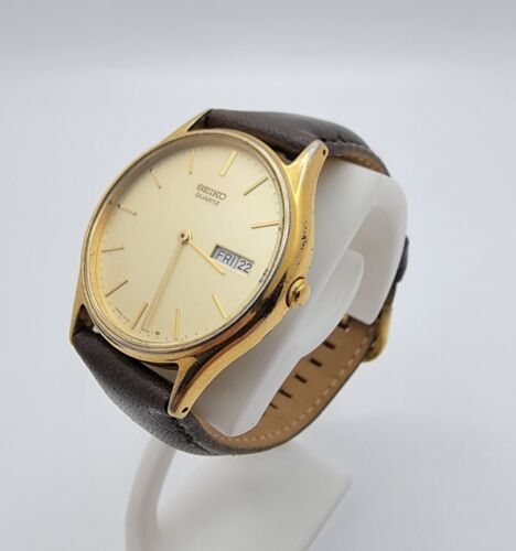 Men s Seiko 5Y23 8039 Gold Tone SS Champagne Day Date Dial Quartz