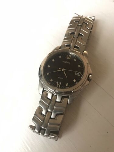 Seiko Men s 7N42 0AM0 100M Steel Bracelet Watch Black Dial