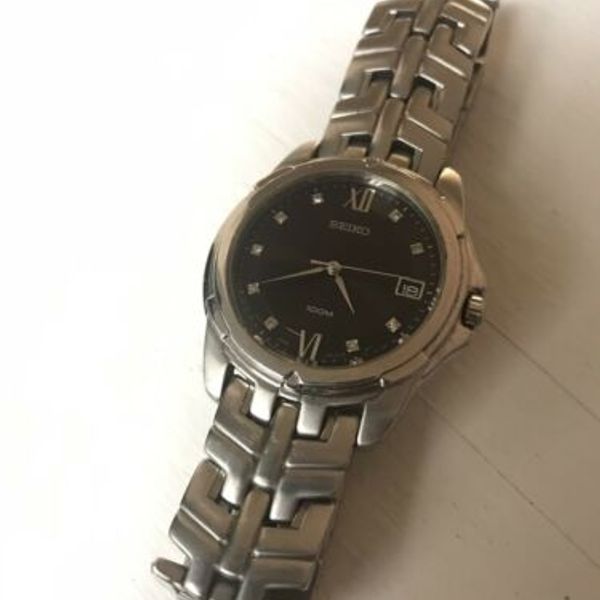 Seiko Men's 7N42-0AM0 100M Steel Bracelet Watch Black Dial Date Free  Shipping | WatchCharts