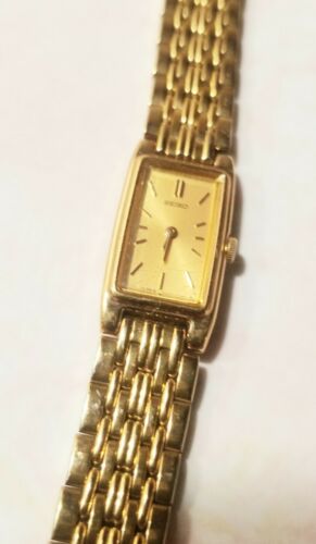 Seiko 2E20 7023 Women s Watch Gold Tone Slim Rectangular Runs New