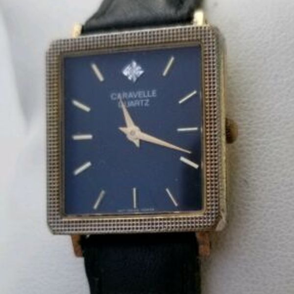 Bulova Caravelle P6 Watch Gold Case Black Diamond Accent Dial