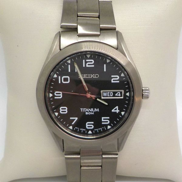 SEIKO BLACK DIAL 38MM TITANIUM CASE MEN'S WATCH SGG711 375.00