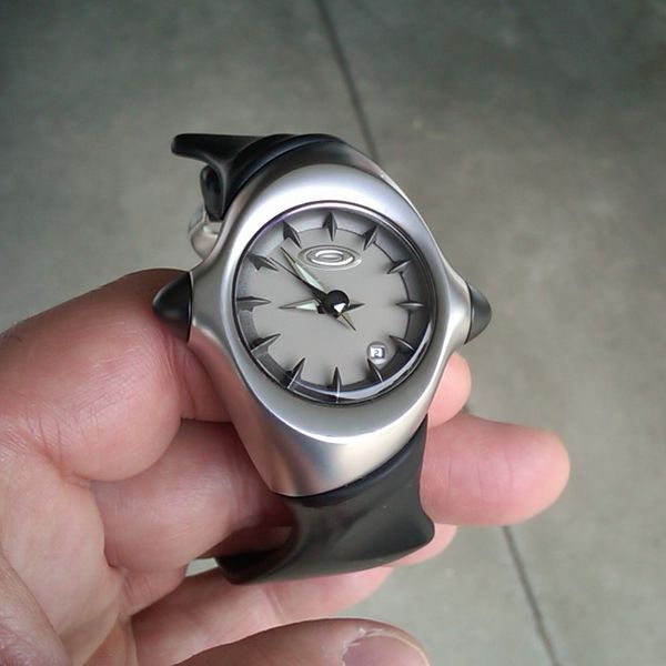$99 - OAKLEY watch CRUSH grey dial black rubber strap quartz | WatchCharts