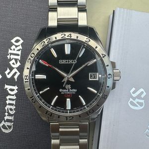 Grand Seiko Automatic GMT SBGM027 Price as of July 2026 | WatchCharts