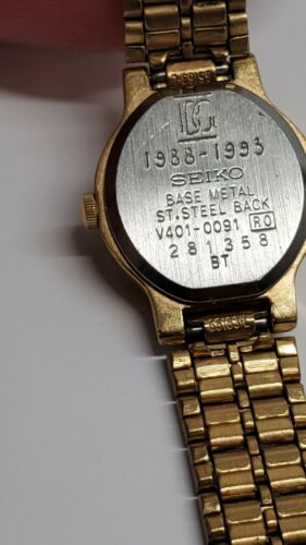 VINTAGE SEIKO SX WOMEN'S GOLD TONE BLACK DIAL QUARTZ WATCH V401