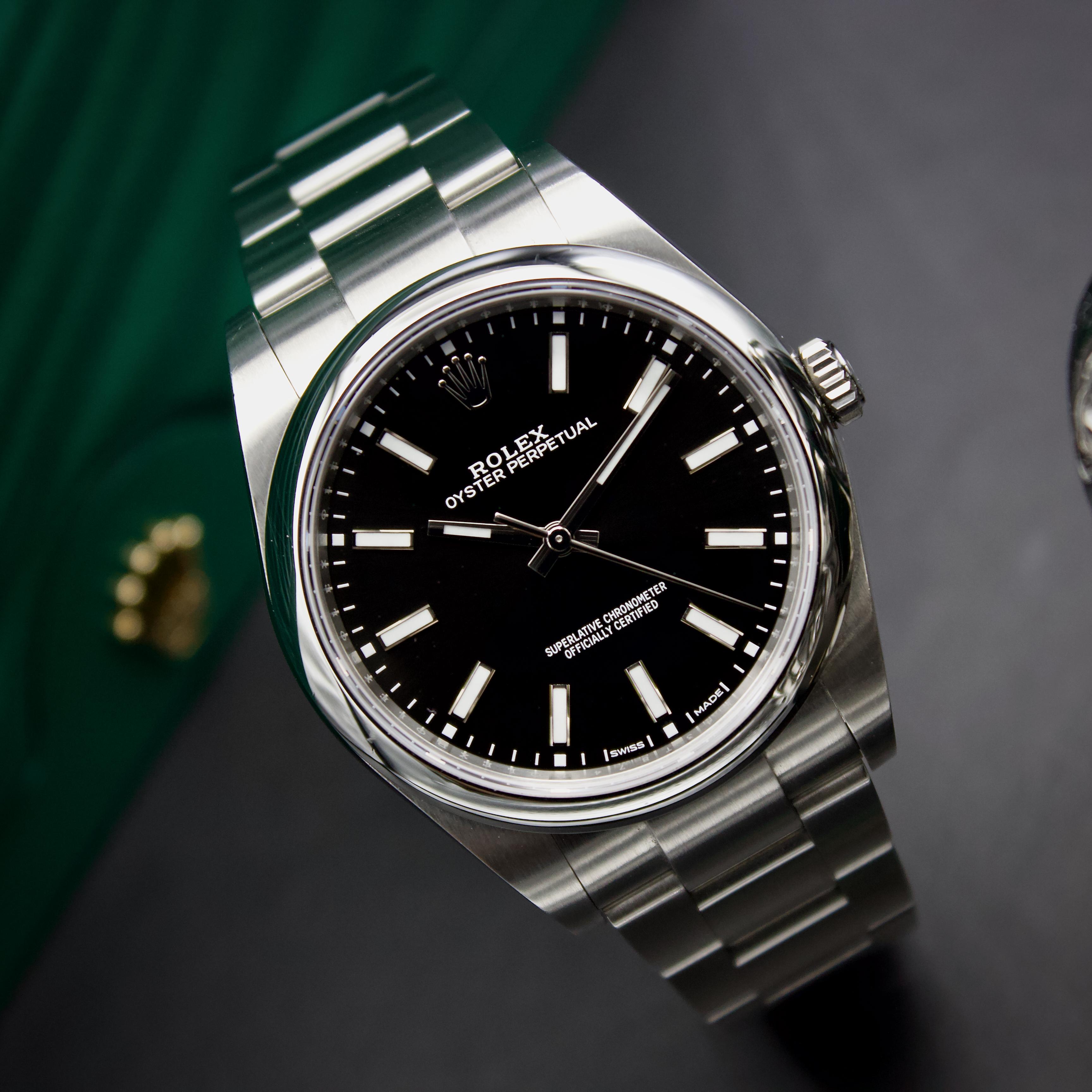 114300 black dial sale