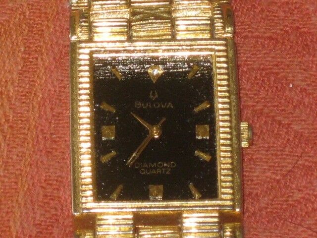 Bulova diamond quartz on sale 18k gold watch price