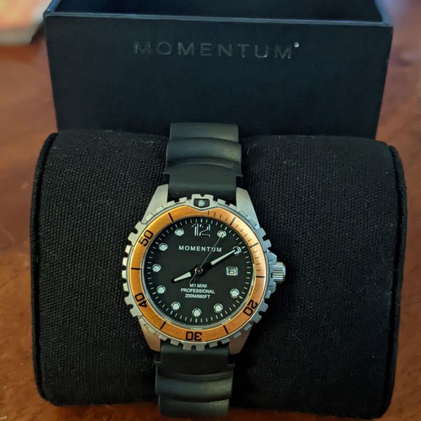 Momentum M1 MINI, SS, SML, AQUA, BLACK RUBBER
