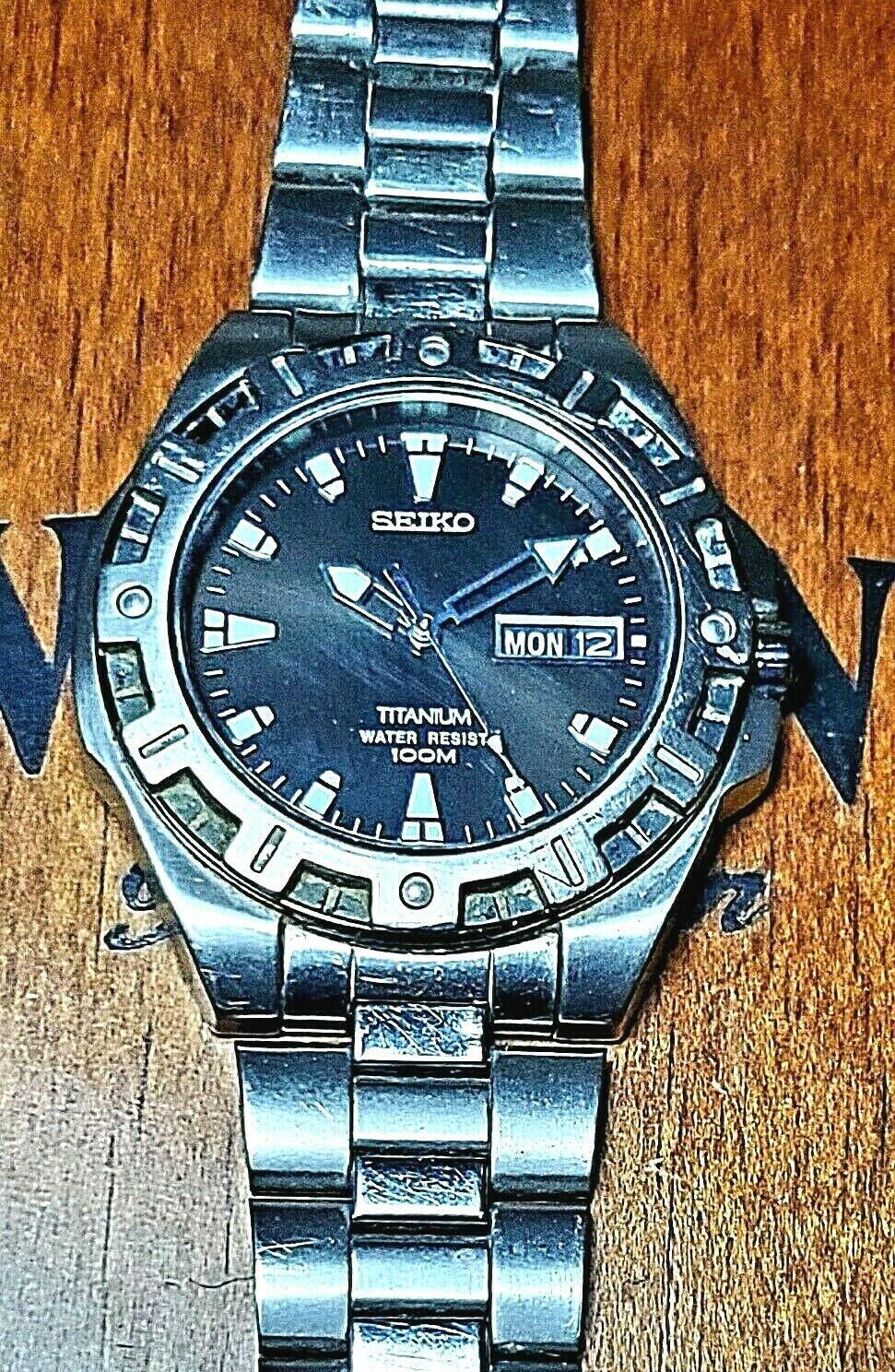 SEIKO 7N43 8310 WR 100M Titanium Sapphire Day Date Quartz Men s