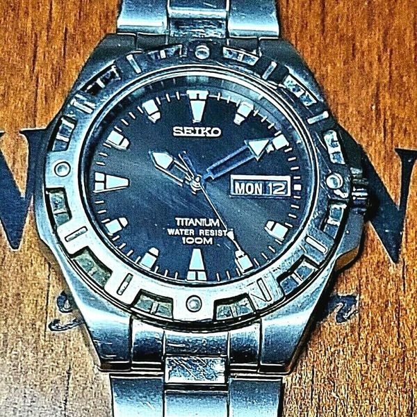 SEIKO 7N43-8310 WR-100M Titanium Sapphire Day/Date Quartz Men's Watch |  WatchCharts