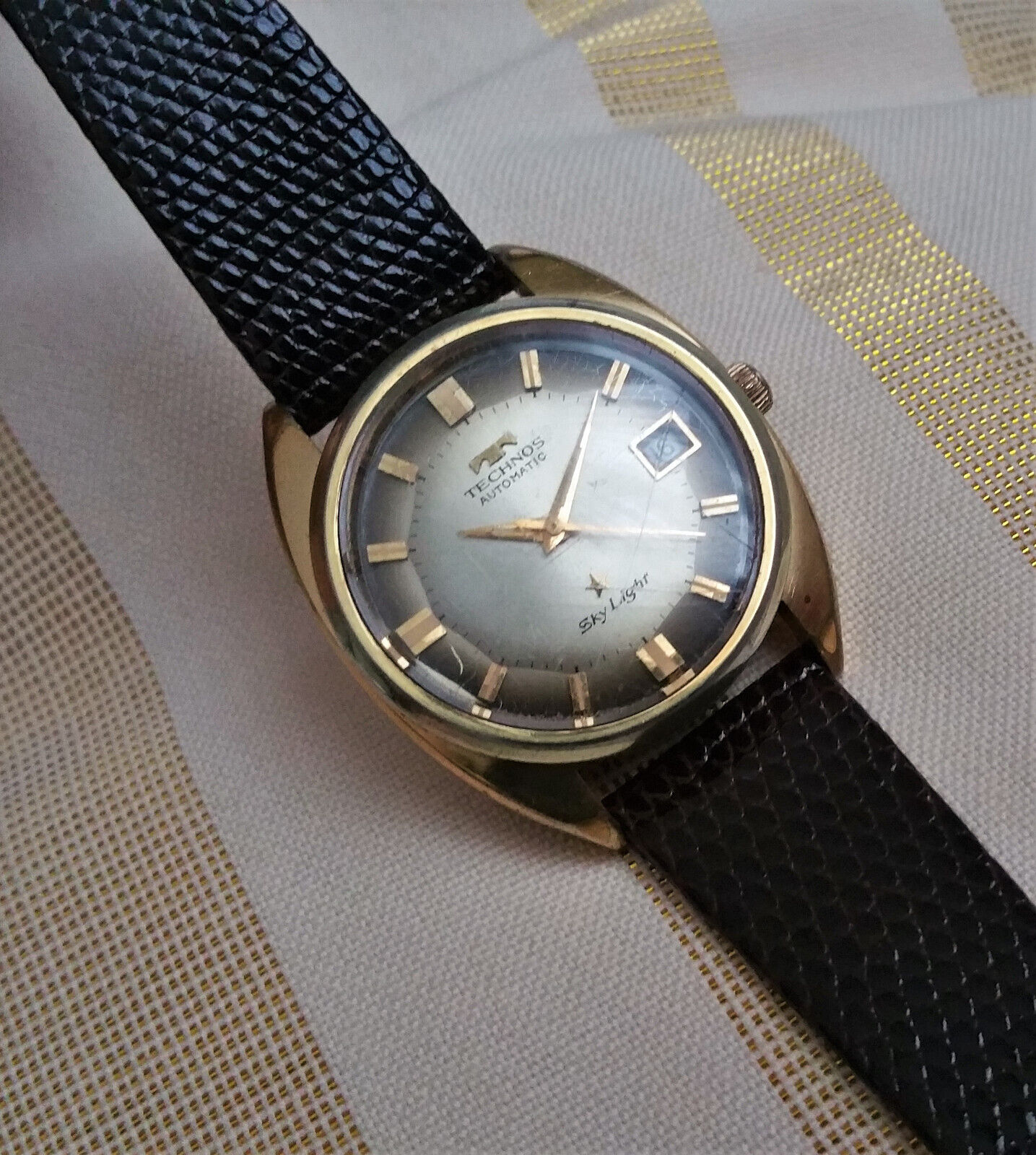 Vintage Swiss Technos Sky Light automatic watch, gold plated, pie