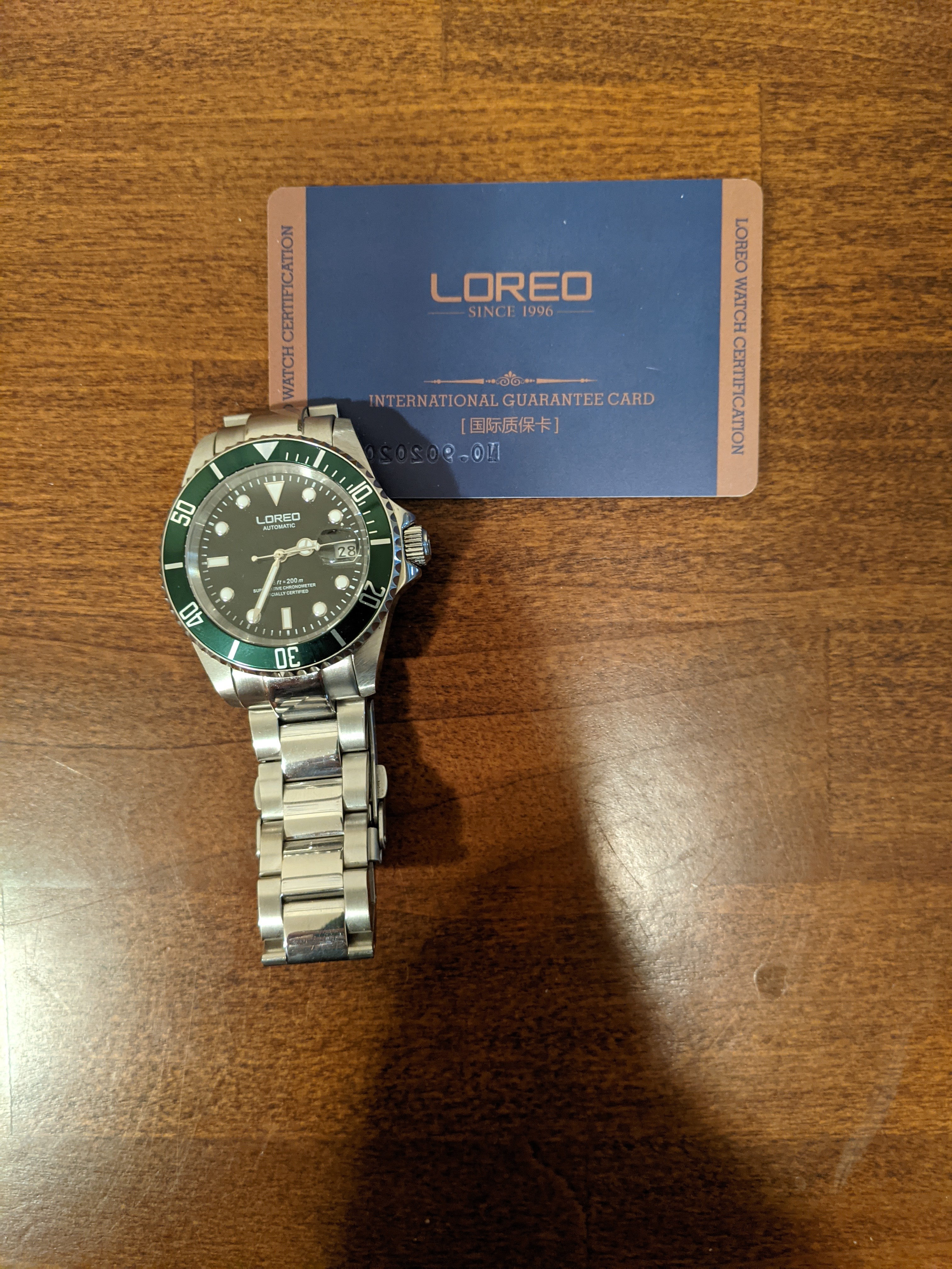 LOREO Luxury Mens Silver Stainless Steel Luminous Sapphire Glass Green  Rotating Bezel Date Waterproof Business Men's Automatic Watch (Silver  Bracelet/Green dial) : Amazon.in: Fashion