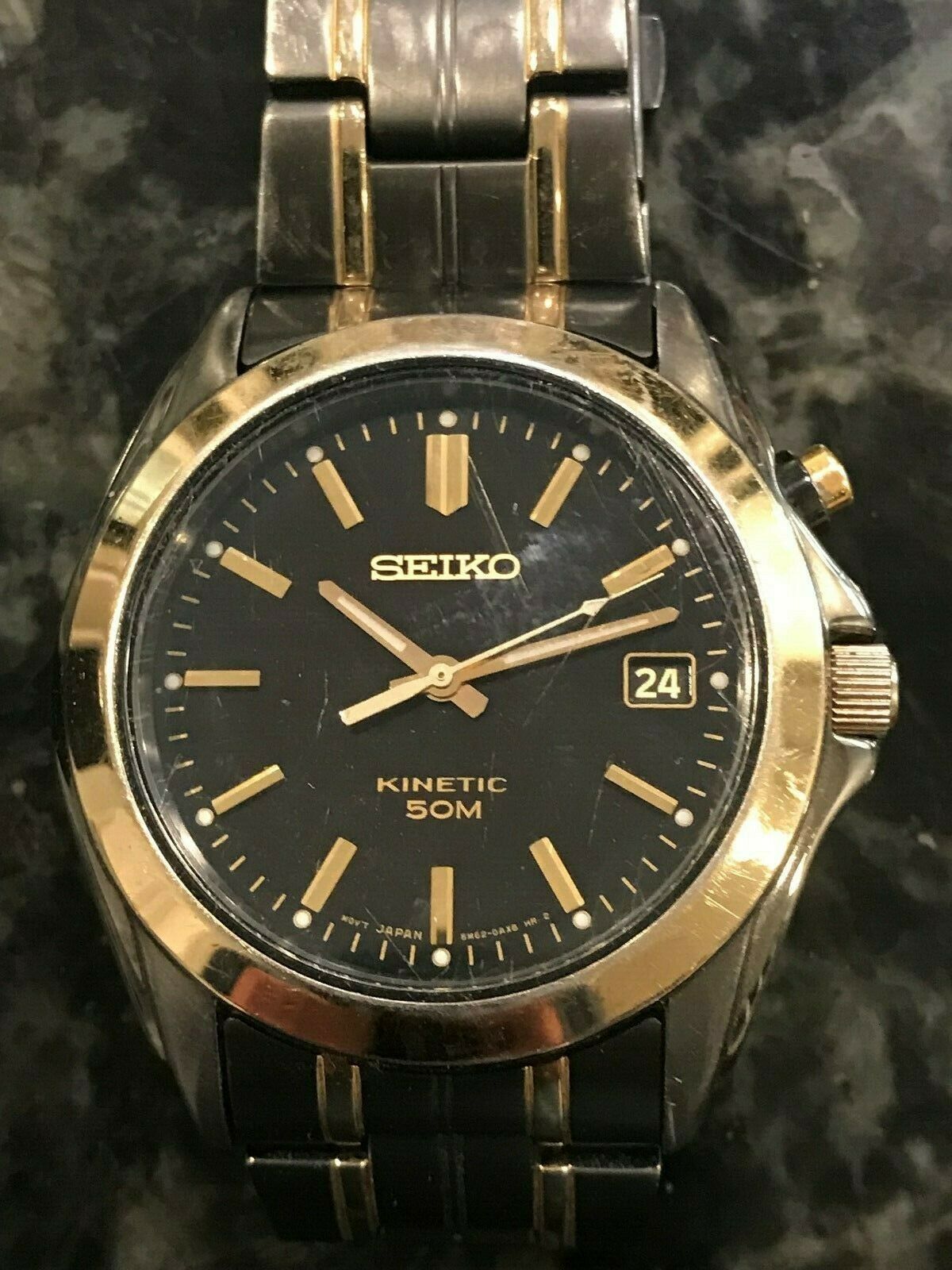 Seiko kinetic 50m 5M62 two toned gold/black watch | WatchCharts