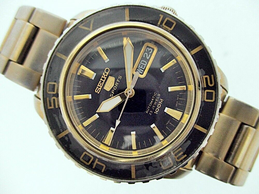 SEIKO 5 SPORTS 7S36 04N0 BLACK DIAL SEE THRU AUTO DAY DATE MENS