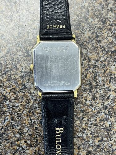 Bulova quartz t4 discount base metal bezel