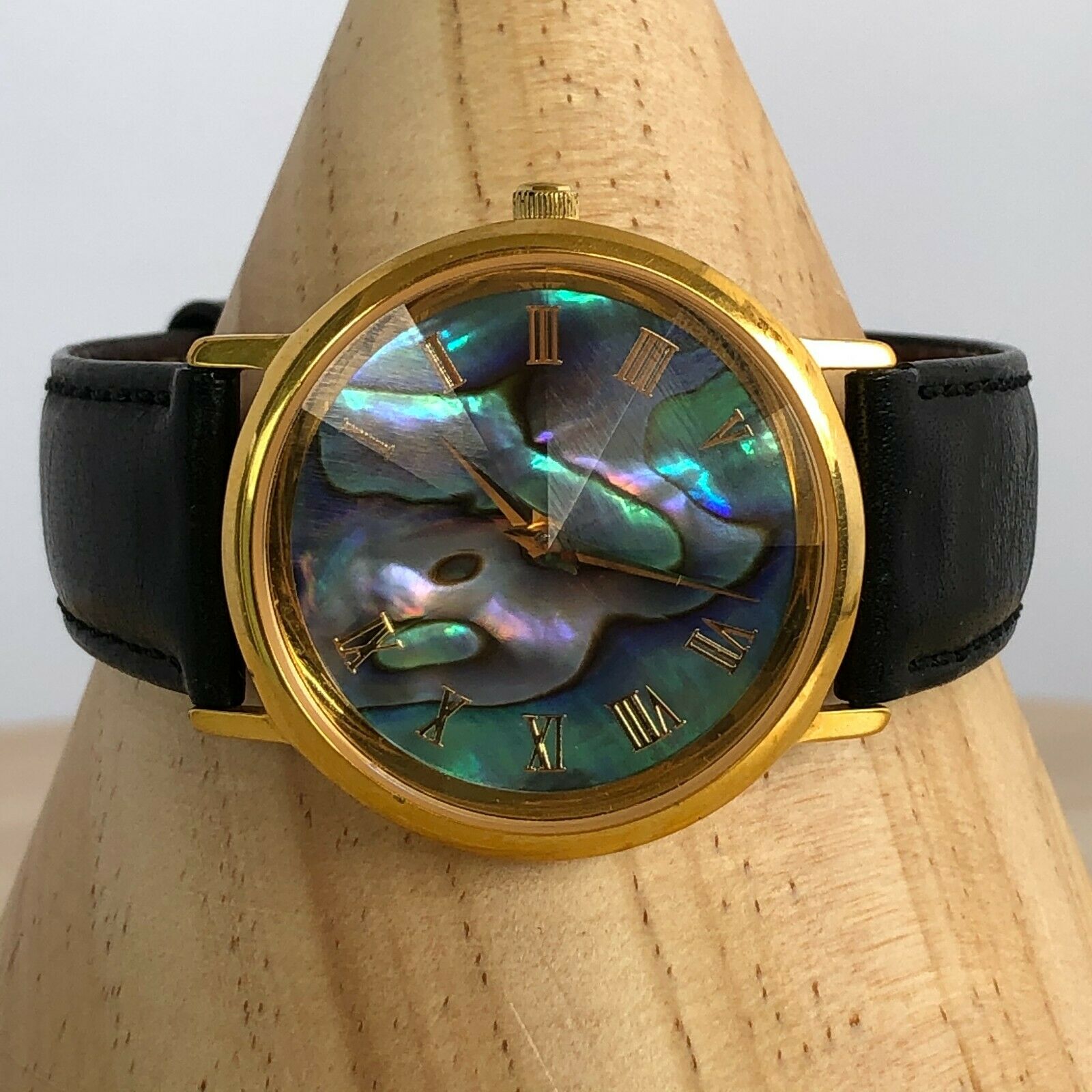 Fossil World Vintage Mother Of Pearl Iridescent Watch Black Band NOT WORKING This retro-inspired watch features an iridescent mother of  main image 4