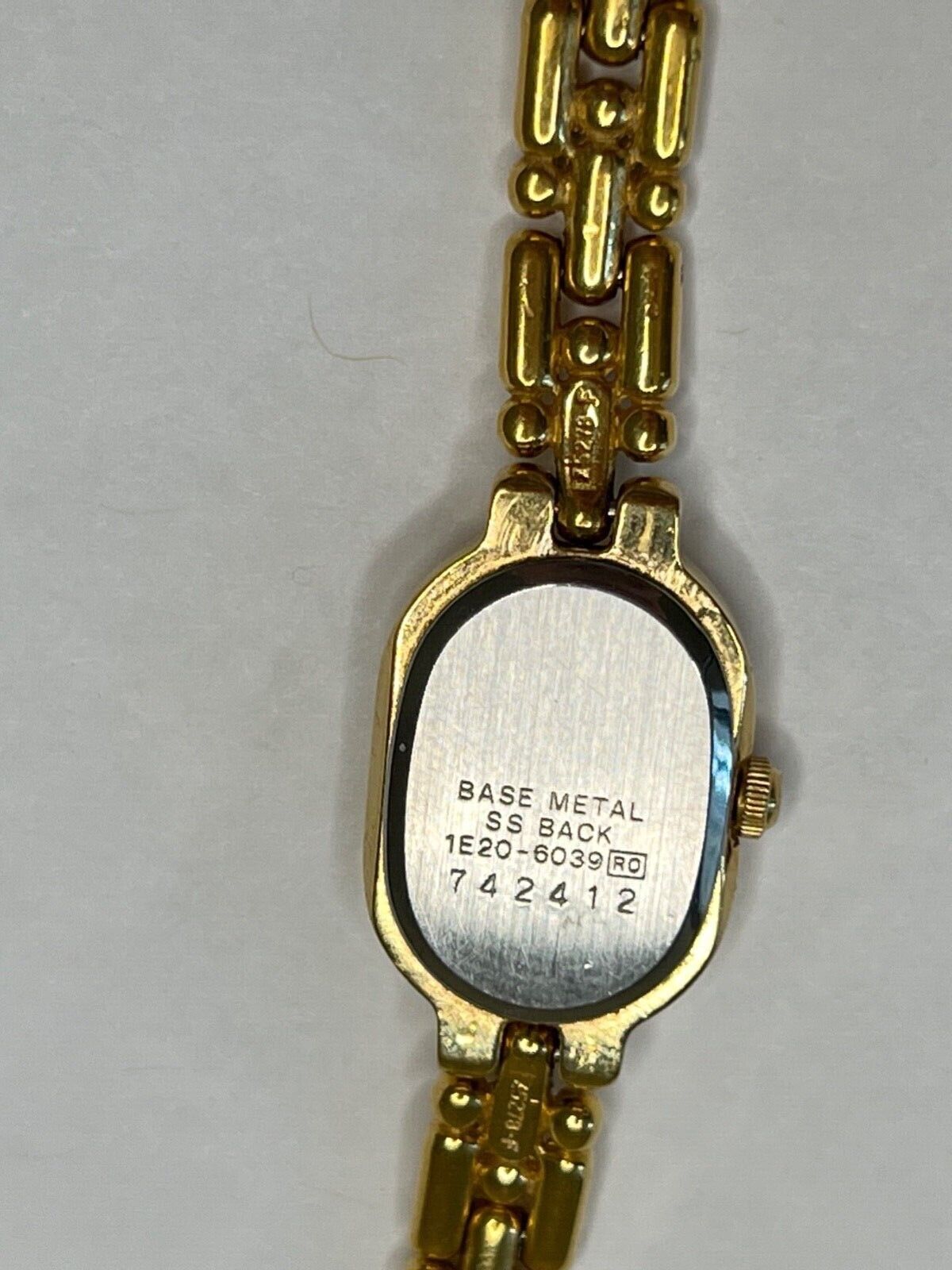 648- Vintage Ladies SEIKO Gold Tone Petite Bracelet Watch, 1E20