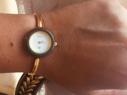 gucci bracelet watch with interchangeable bezels