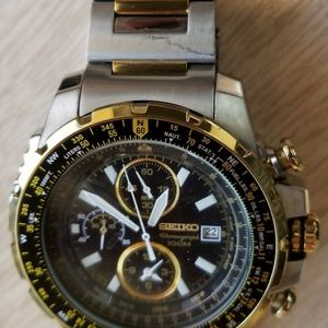 Seiko Chronograph Mens Watch - Gold/Silver Band - Black Face - 7T62-OJRO |  WatchCharts