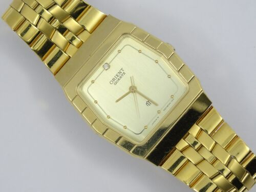 Orient quartz gold discount watch