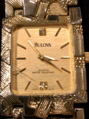 bulova 18k gold watch swiss made