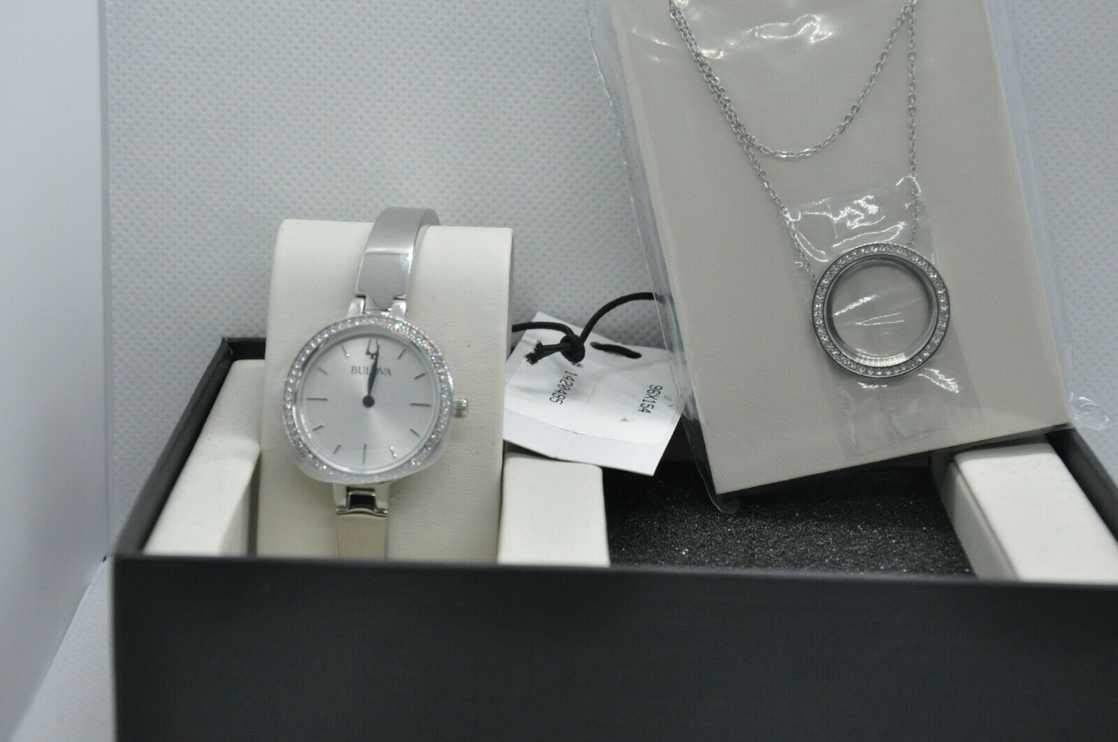 Bulova stainless steel ladies watch shop and crystal halo pendant set