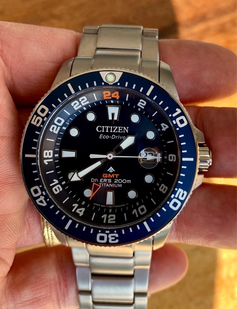 Citizen eco drive titanium gmt best sale