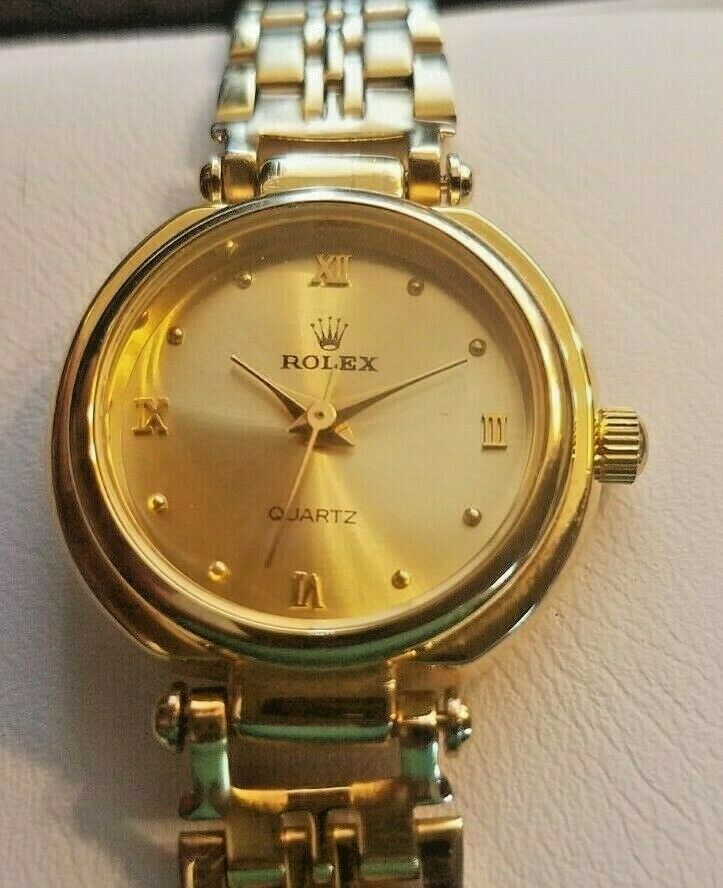 Ladies gold tone watch says Rolex ST-638999 | WatchCharts