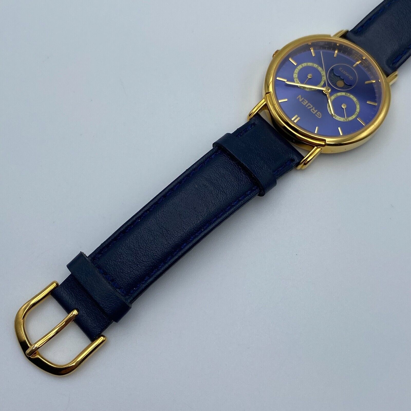 Gruen Gold Tone w/ Blue Gem-Style Cover Hidden Dial Cuff Bracelet Quartz Watch GRUEN Ladies Quartz Watch With Blue and Clear Crystals. Gold  main image 2