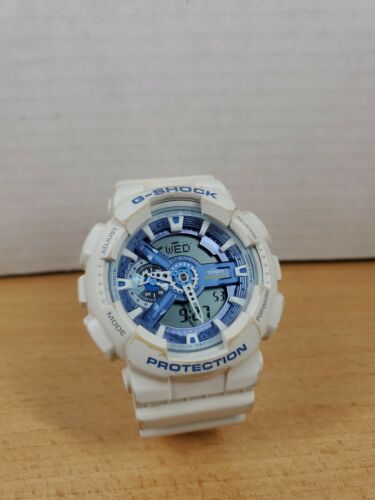 white g shock with blue face