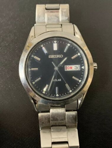 seiko silvertone black dial solar calendar watch