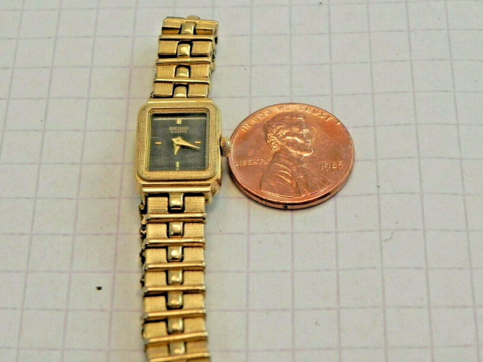 Woman's Seiko 1E20-5689 Dress Wrist Watch-New Battery-Gold Tone
