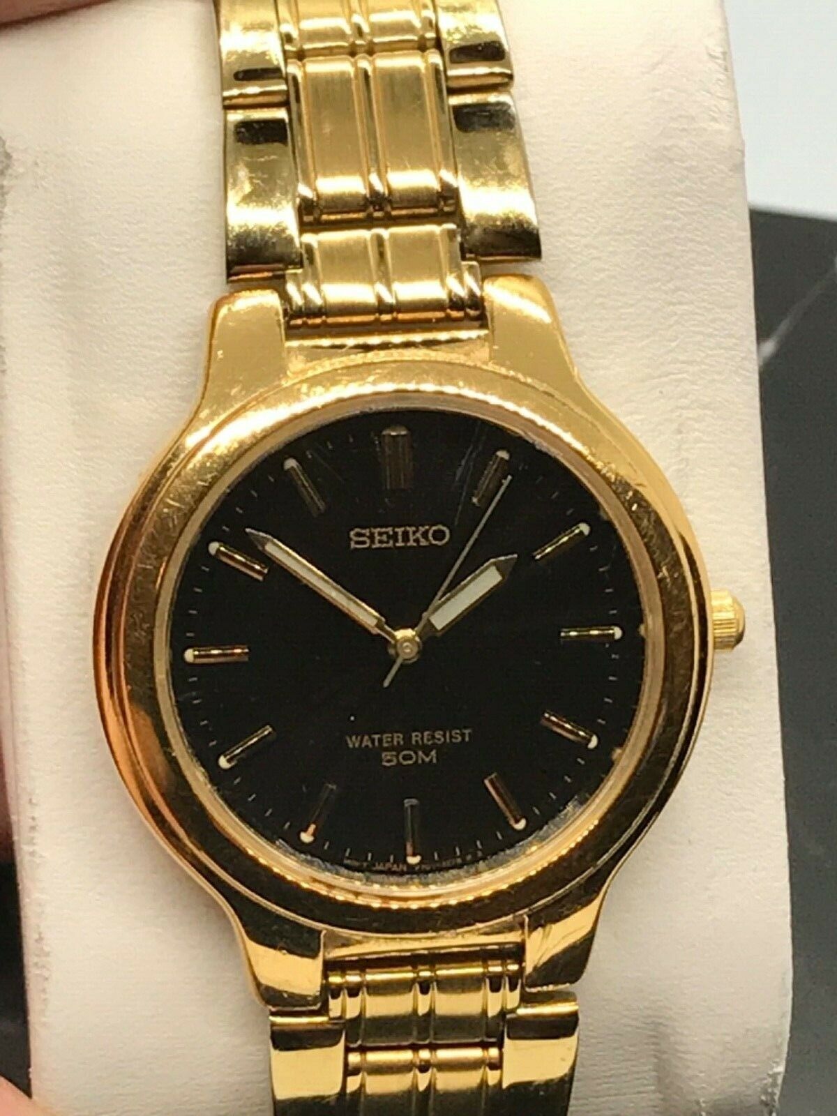 Seiko V701-2H10 Black Sunburst Dial gold tone band WR 50M