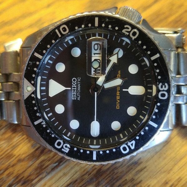 Seiko SKX007 with Sapphire Crystal with Day/date cyclops | WatchCharts