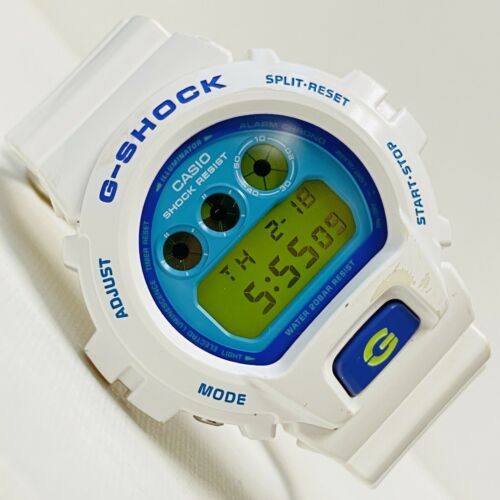 Casio G-Shock Mens White Purple Teal Green Dial 50mm Watch Digital