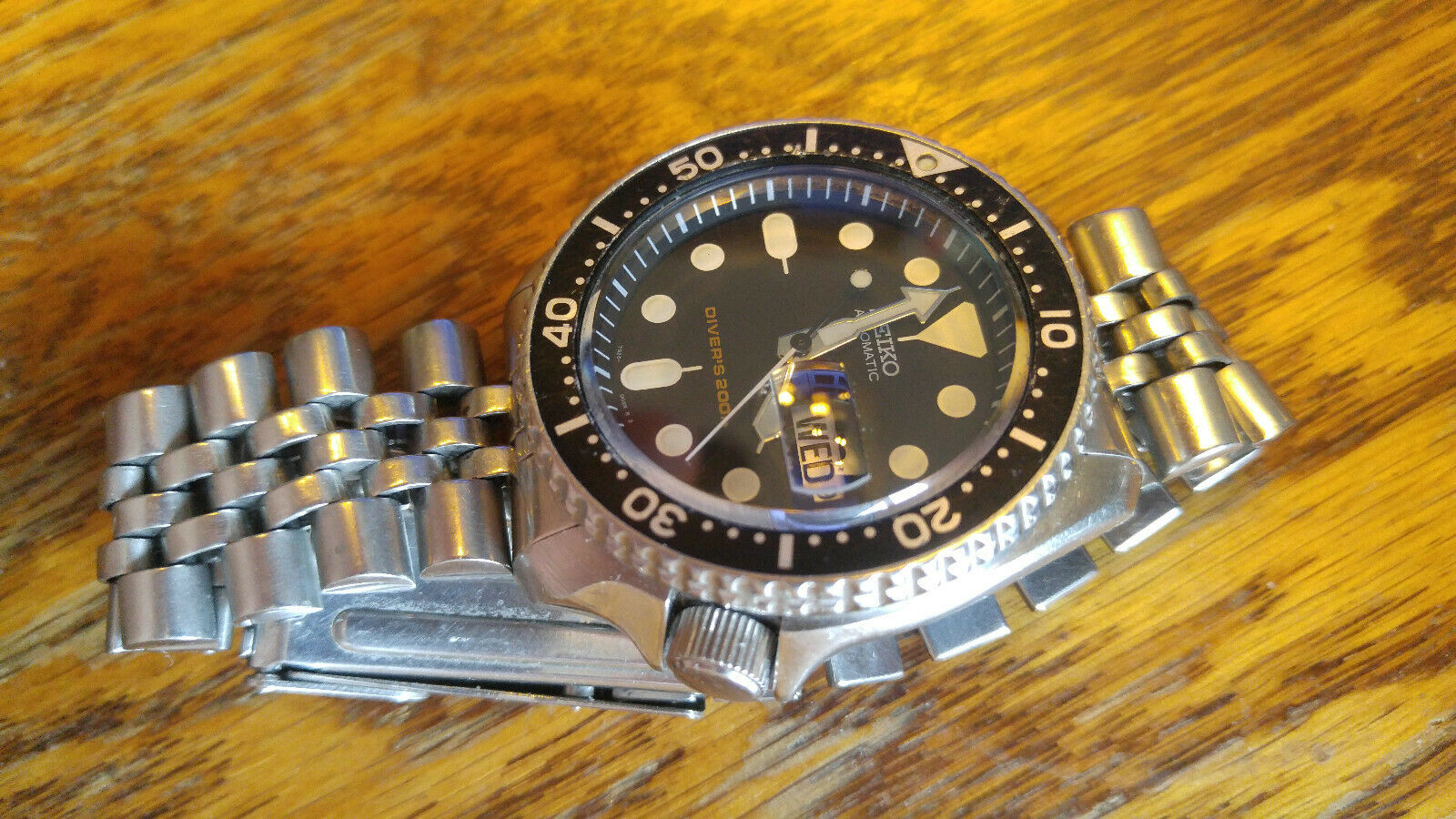 Seiko SKX007 with Sapphire Crystal with Day/date cyclops | WatchCharts