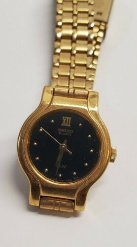 VINTAGE SEIKO SX WOMEN'S GOLD TONE BLACK DIAL QUARTZ WATCH V401