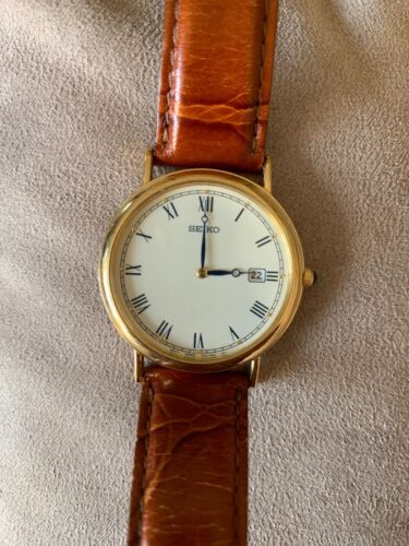 Men s Seiko 7N39 0A19 Gold Tone Roman Numeral Dial Dress Watch