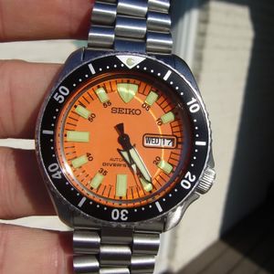 SOLD: Seiko SKX007 with Orange Monster dial, chapter ring and hands, Seiko  President bracelet | WatchCharts
