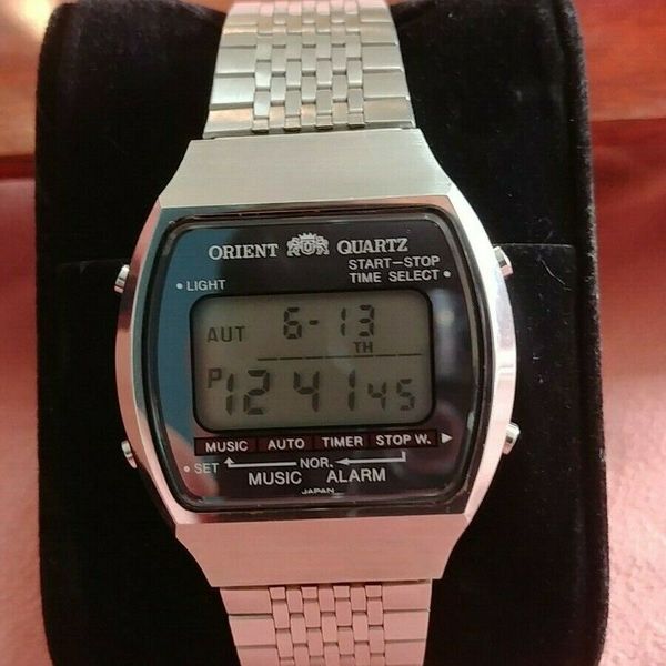 Orient lcd music alarm melody watch mirror dial. 700101-40 LP