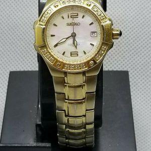 Seiko Women's 7N82-0CG0 Coutura Diamond Gold -Tone Pink Mother of Pearl  Watch | WatchCharts