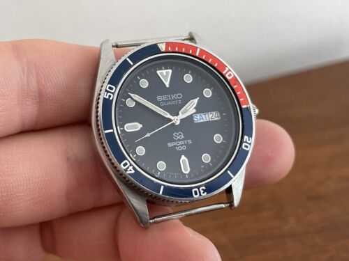 Vintage Seiko 8123-6109 Quartz SQ Sports 100 Pepsi Day Date
