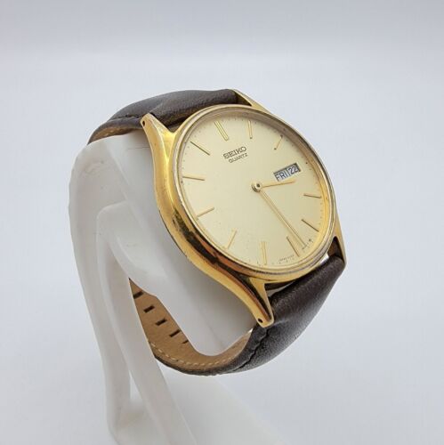 Men s Seiko 5Y23 8039 Gold Tone SS Champagne Day Date Dial Quartz