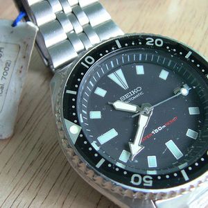 FS: 2 NOS and Sealed Seiko 7002 150m Automatic Divers Black in Bracelet and  Rubber Rare Find | WatchCharts